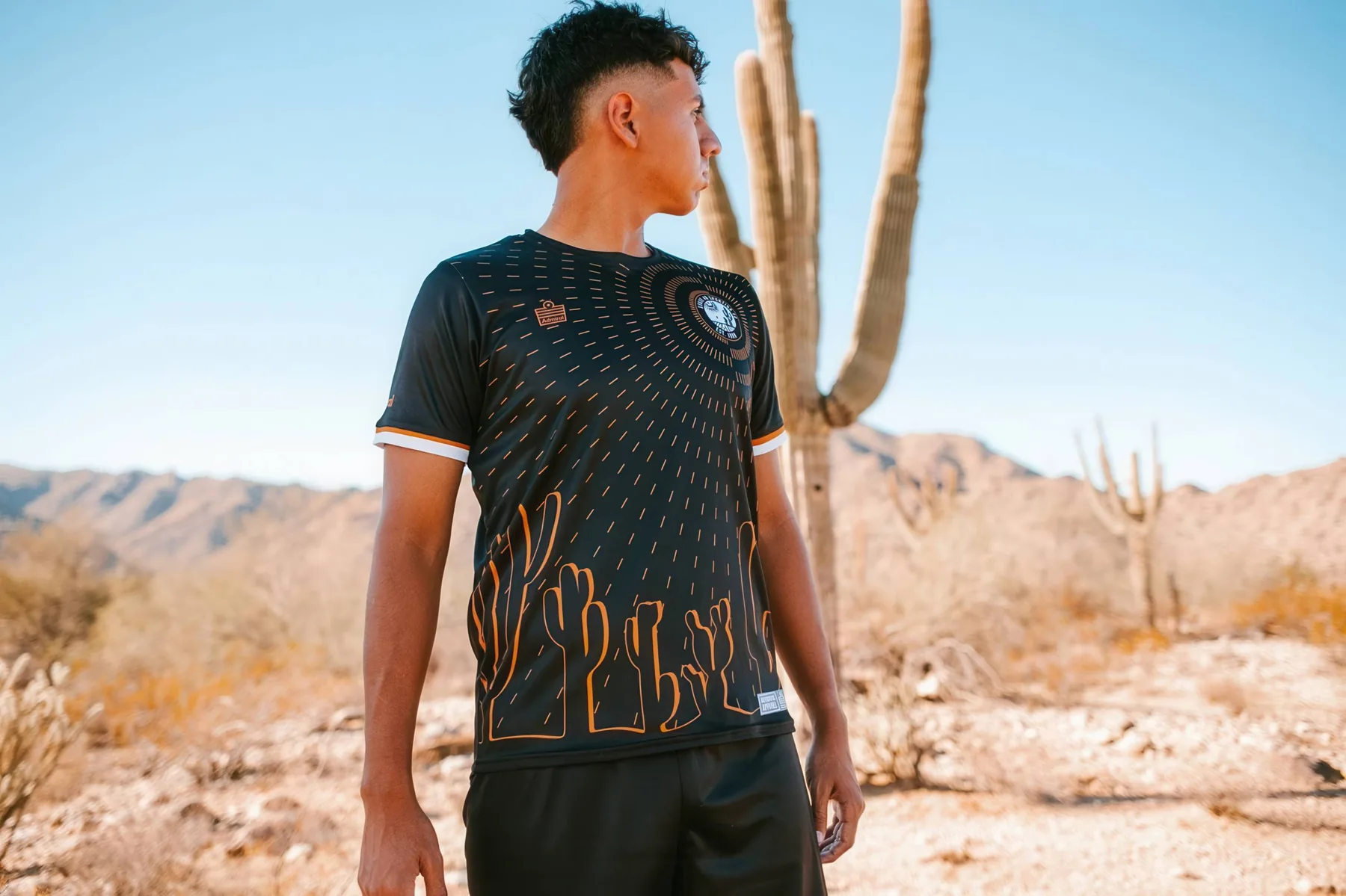 State 48 player wearing the black and copper saguaro kit in the desert